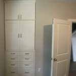 Modern new white colored office cabinets, doors closed