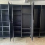 Professionally installed black garage cabinets, open doors