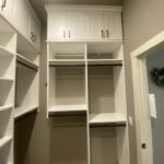 Custom height walk-in closet shelves and cabinets