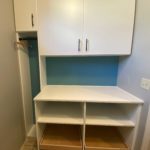 Newly installed white cabinets in mud room