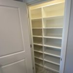 Professionally installed white shelving in pantry