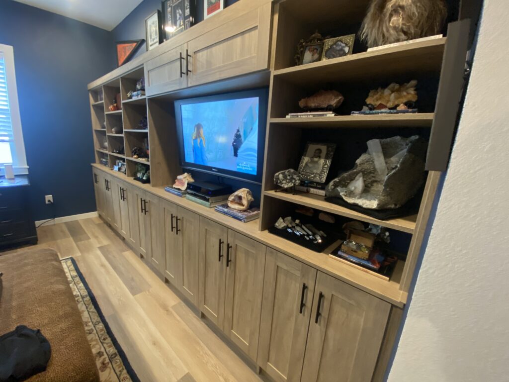 Brown Entertainment Center with Black hardware - Call PNW Closets for custom entertainment centers in the Vancouver, WA Area