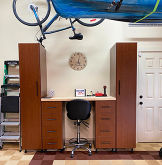 Overhead bike rack above workbench optimizes garage storage in Portland OR home