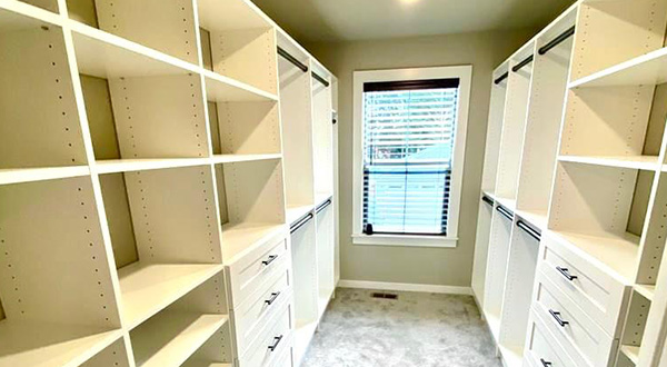 a long and narrow bedroom closet in portland home, renovated into a highly efficient walk-in closet