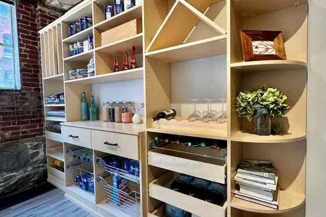 Pantry with curved edges and custom shelves