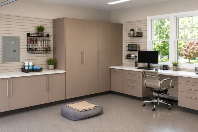 Garage home office with a built-in desk and tall filing cabinets
